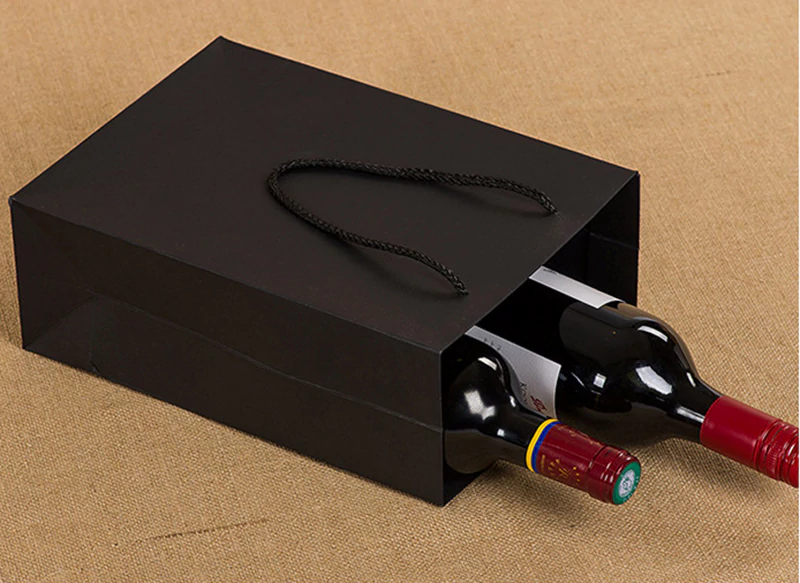 black handheld paper bag front