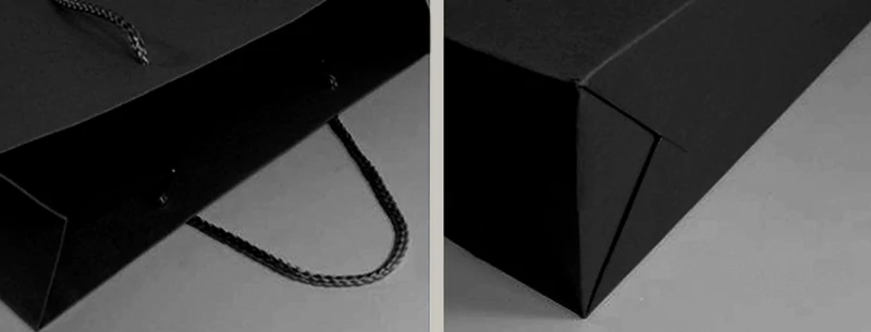 black handheld paper bag side