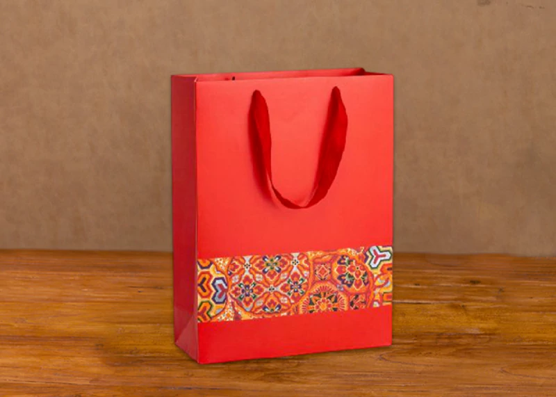 Red ethnic style handheld paper bag front