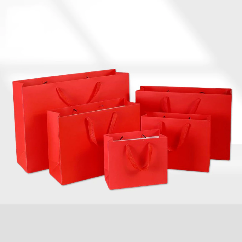 Red handheld paper bag front