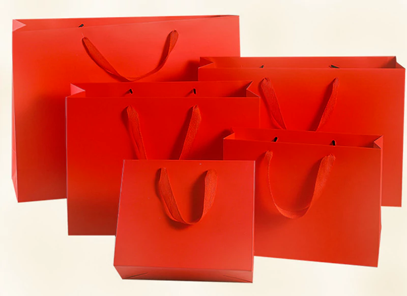 Red handheld paper bag